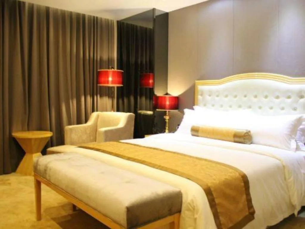 Bed in Golden Phoenix International Hotel