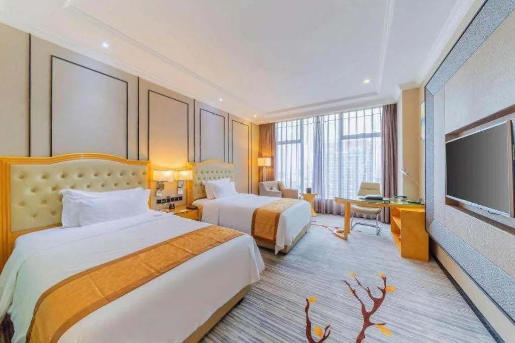 Bed in Golden Phoenix International Hotel