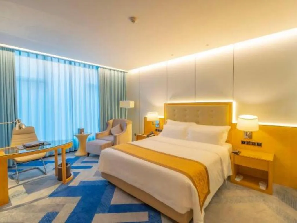 Bed in Golden Phoenix International Hotel