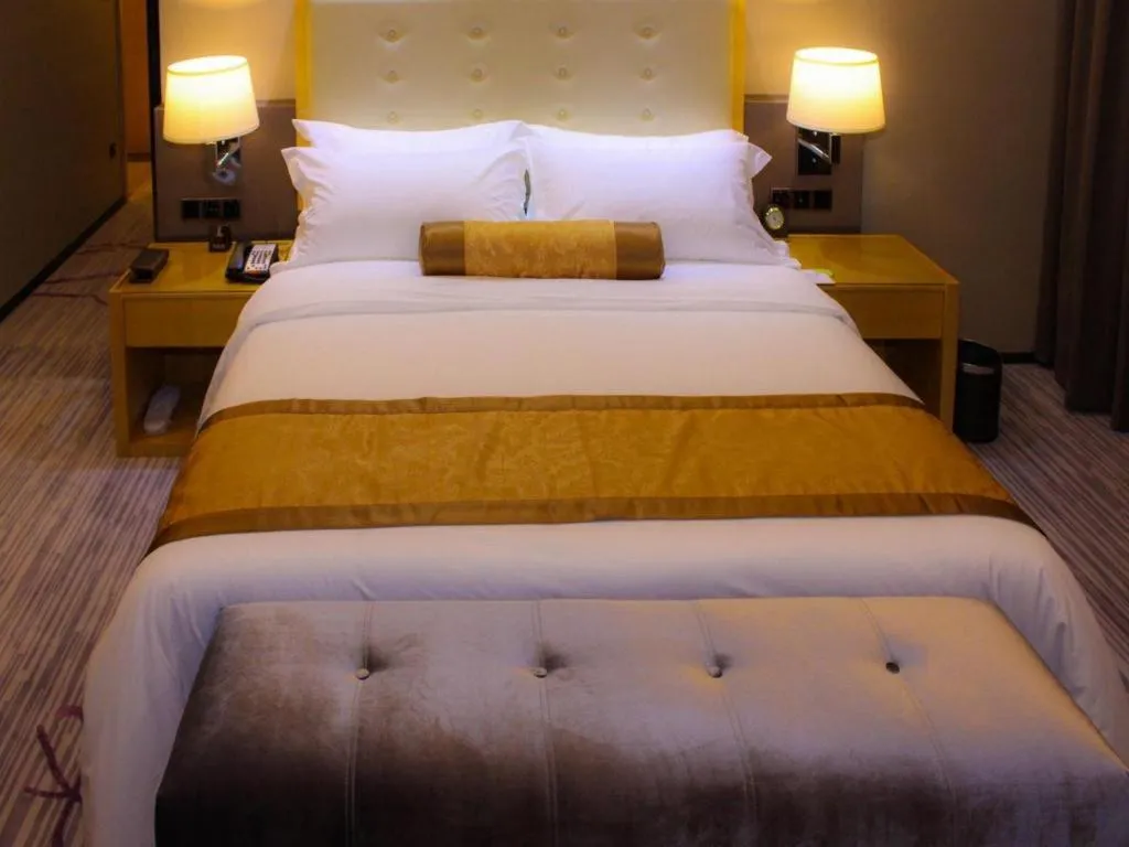 Bed in Golden Phoenix International Hotel