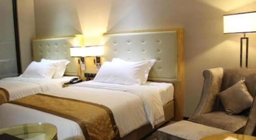 Bed in Golden Phoenix International Hotel