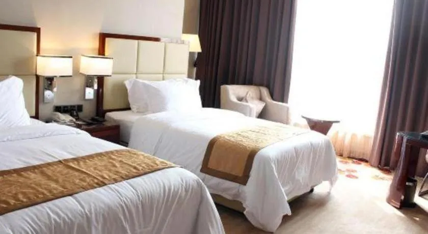Bed in Golden Phoenix International Hotel