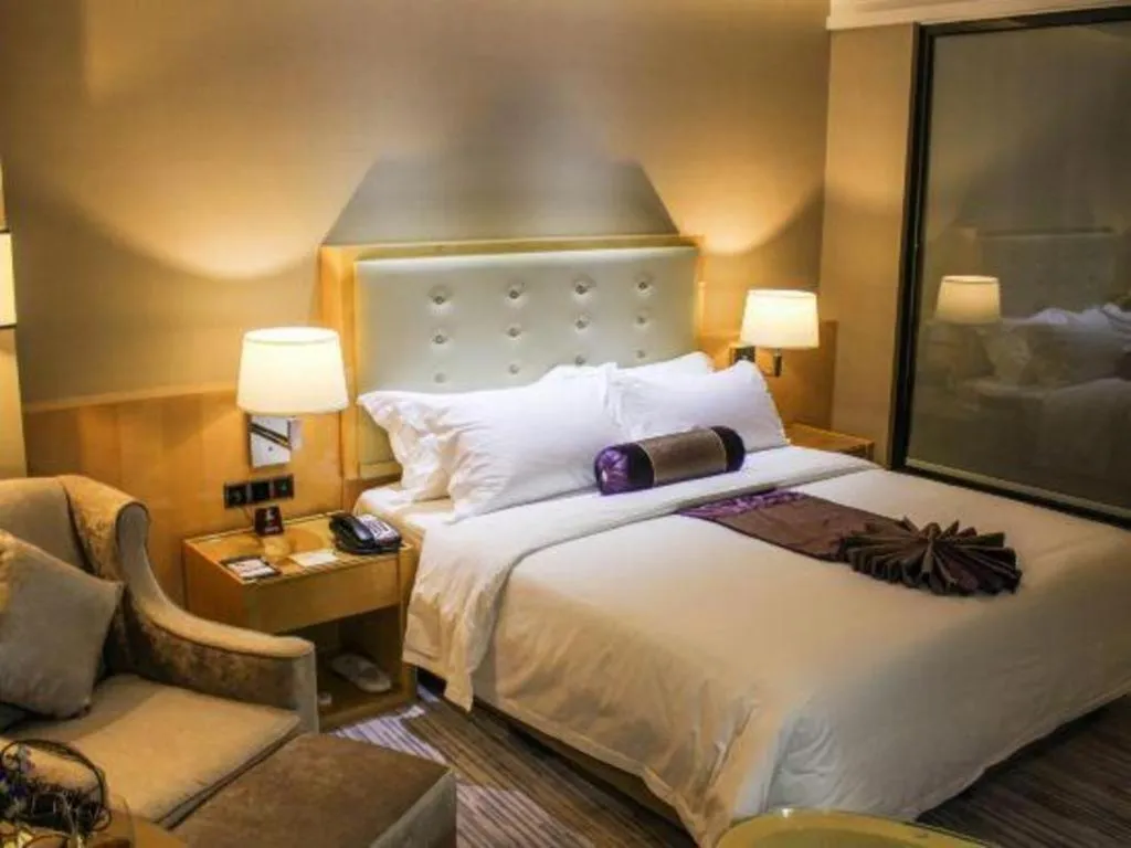 Bed in Golden Phoenix International Hotel