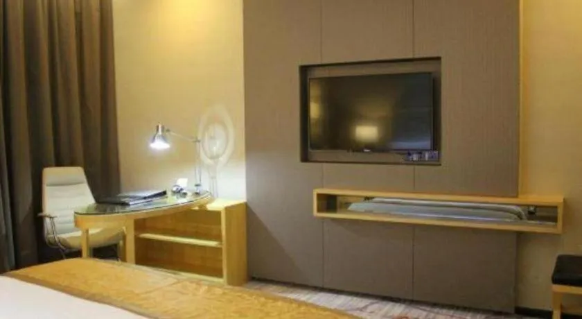 Bed in Golden Phoenix International Hotel