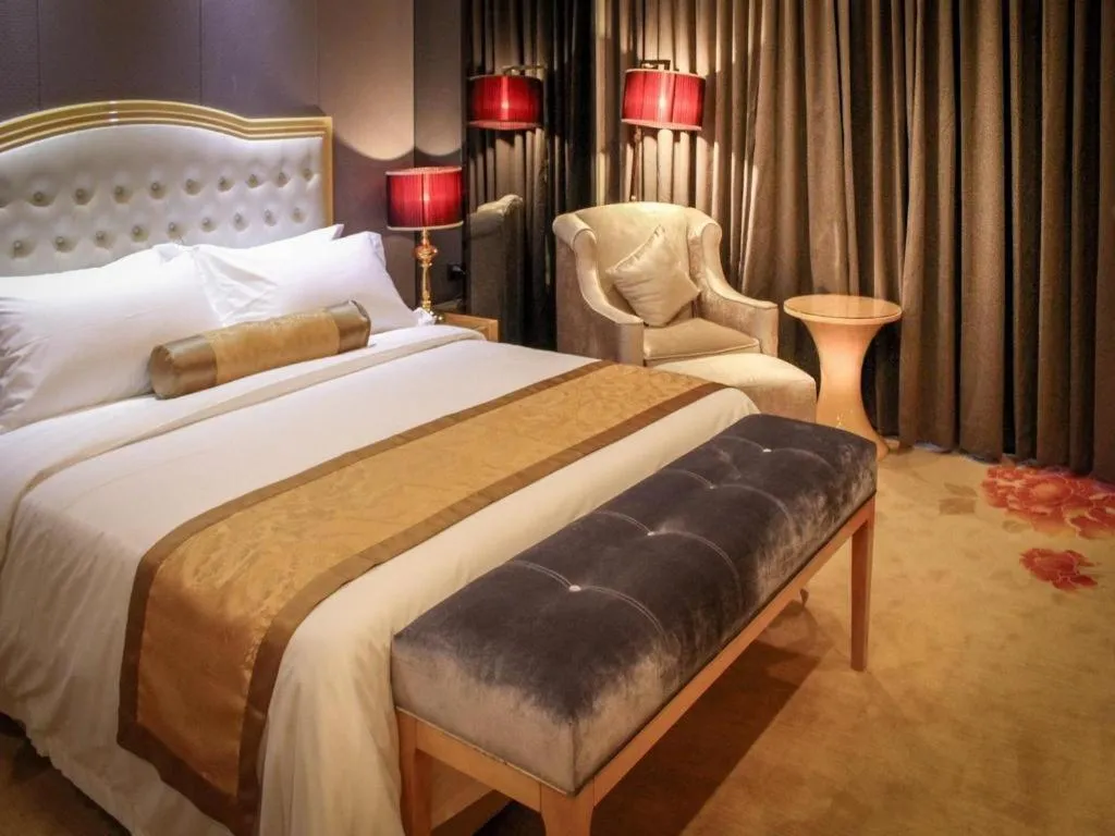 Bed in Golden Phoenix International Hotel