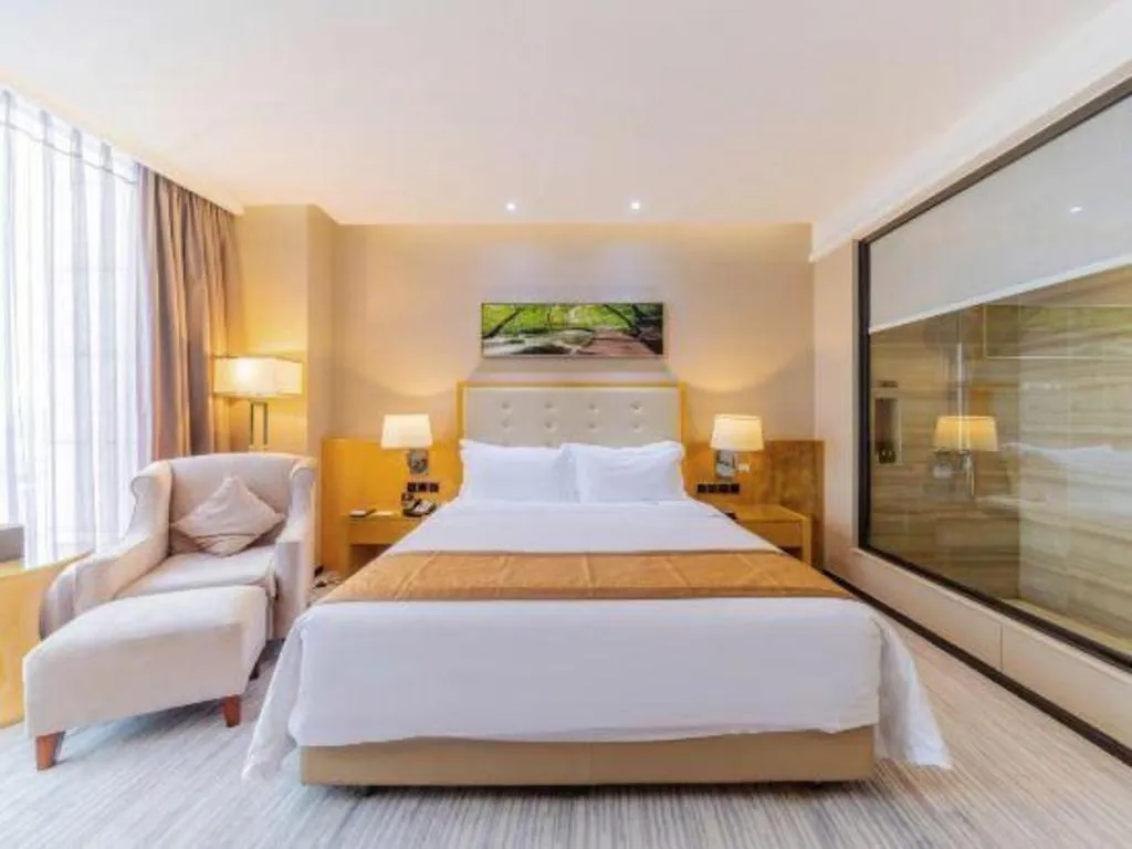 Bed in Golden Phoenix International Hotel