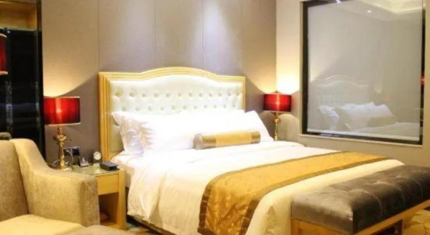 Bed in Golden Phoenix International Hotel