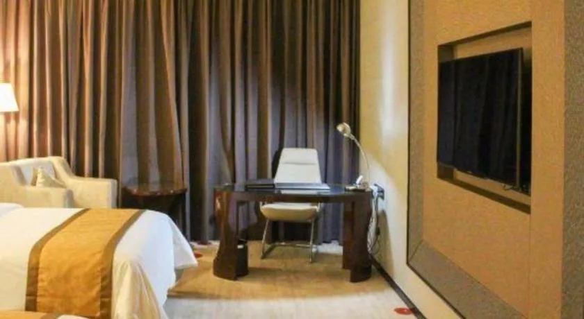 Bed in Golden Phoenix International Hotel