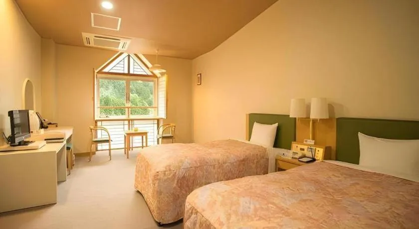 Bed in Hotel Hikyounoyu