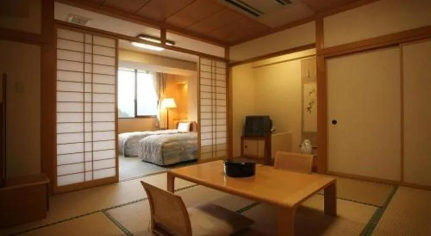 Bed in Hotel Hikyounoyu