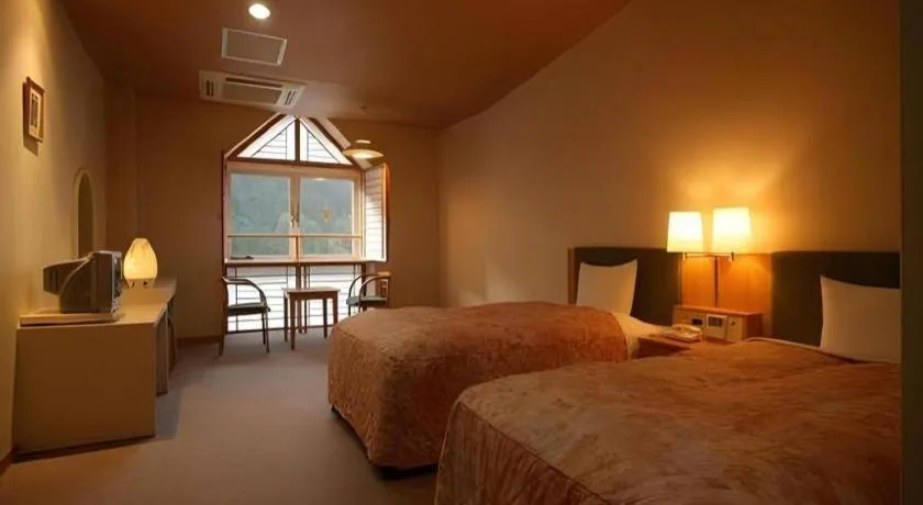 Bed in Hotel Hikyounoyu