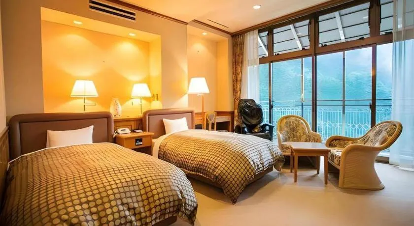 Bed in Hotel Hikyounoyu