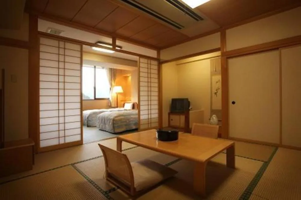 Bed in Hotel Hikyounoyu