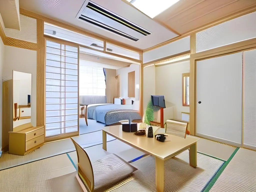 Bed in Hotel Hikyounoyu