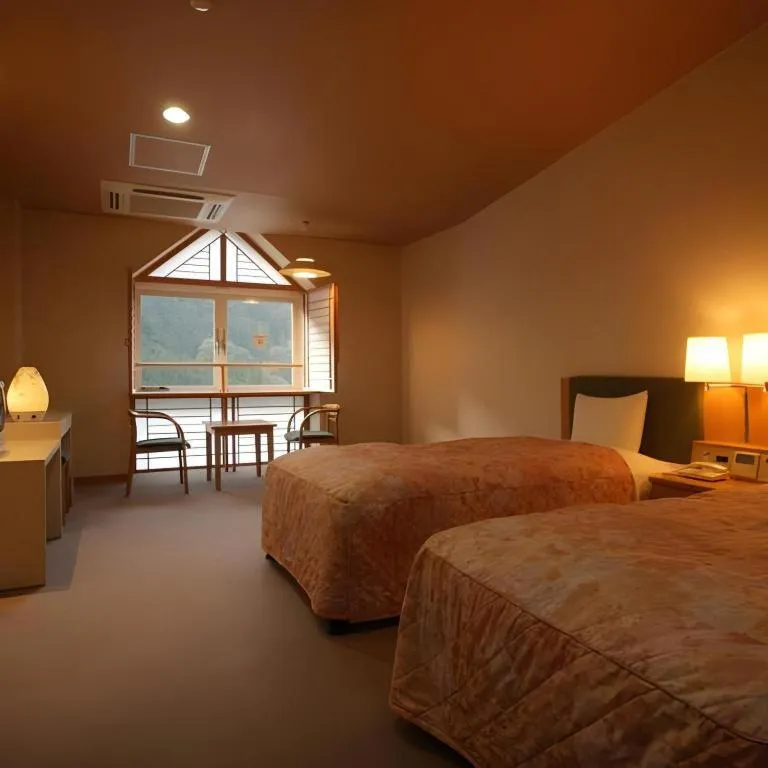 Bed in Hotel Hikyounoyu