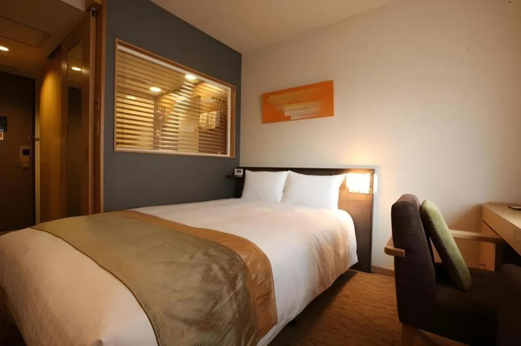 Bed in Ochanomizu Hotel Juraku