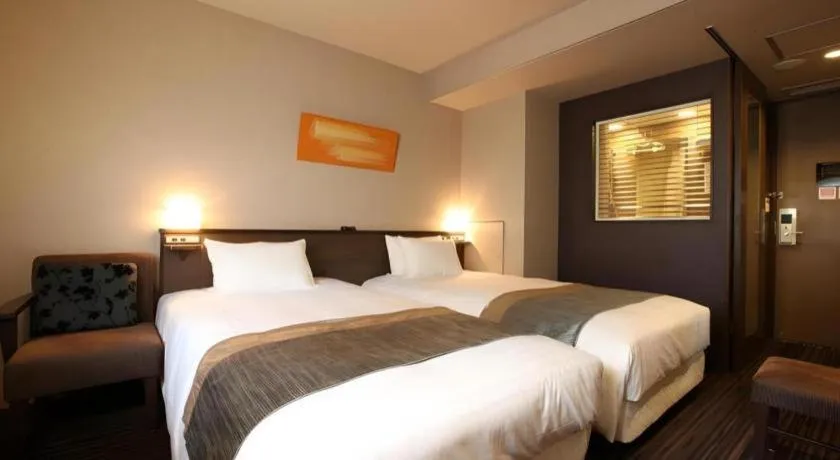 Bed in Ochanomizu Hotel Juraku