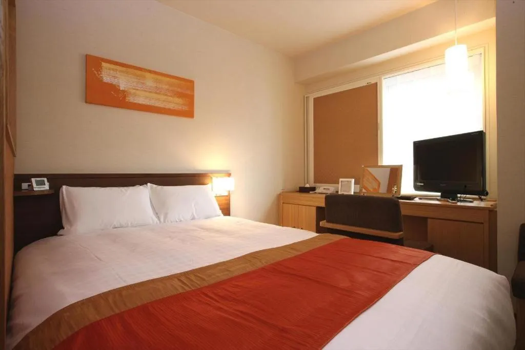 Bed in Ochanomizu Hotel Juraku