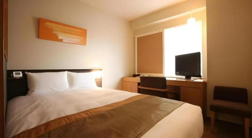 Bed in Ochanomizu Hotel Juraku