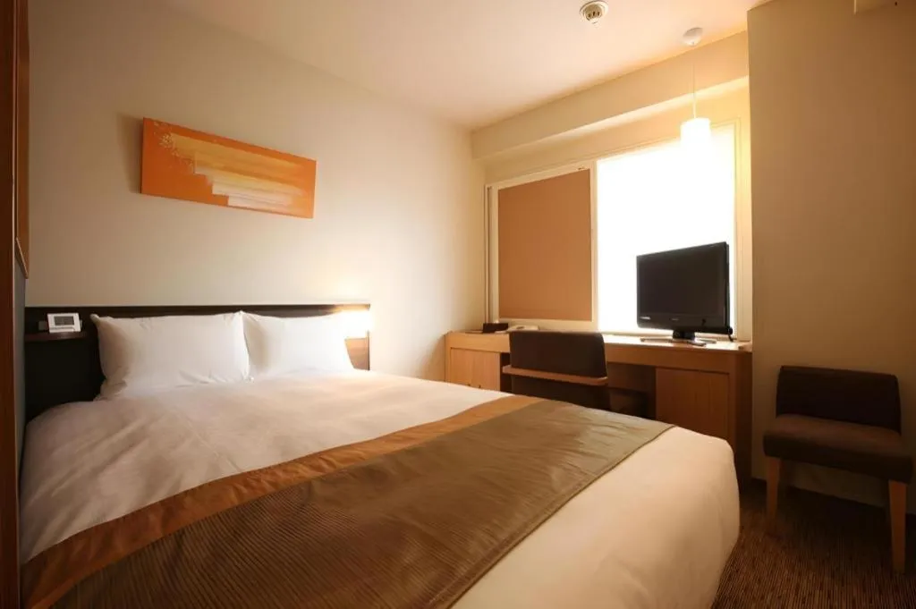 Bed in Ochanomizu Hotel Juraku