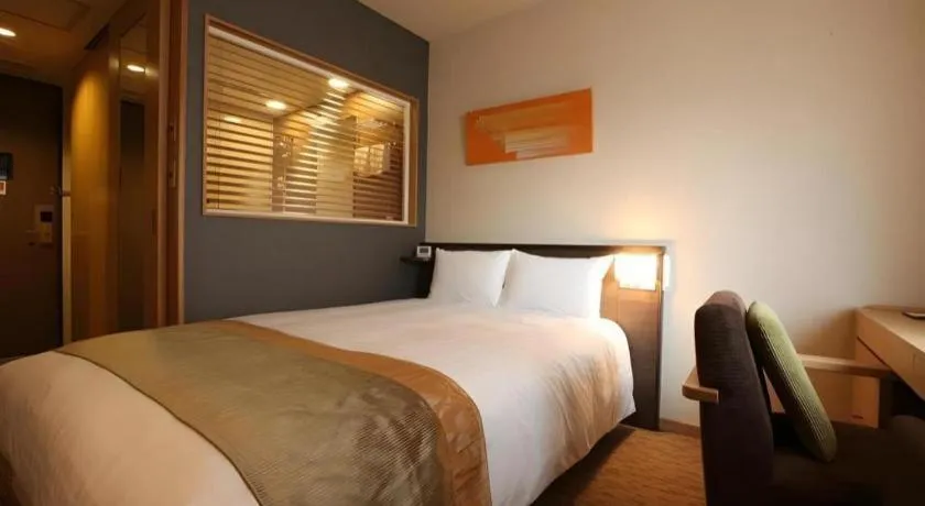 Bed in Ochanomizu Hotel Juraku