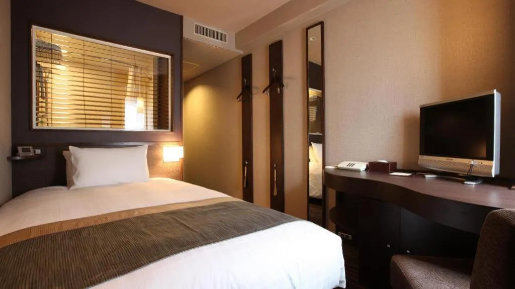 Bed in Ochanomizu Hotel Juraku