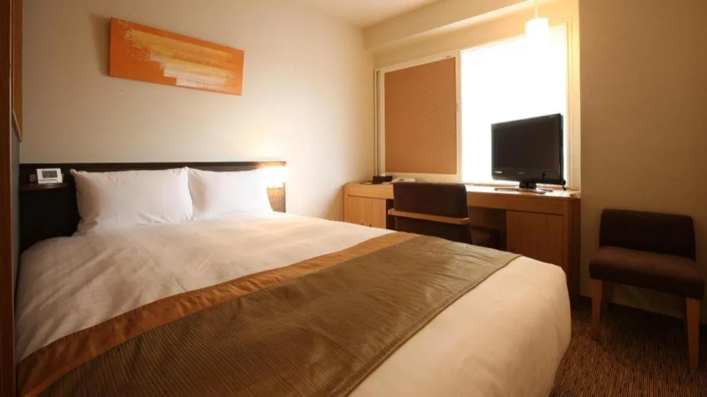 Bed in Ochanomizu Hotel Juraku