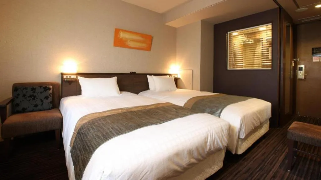 Bed in Ochanomizu Hotel Juraku