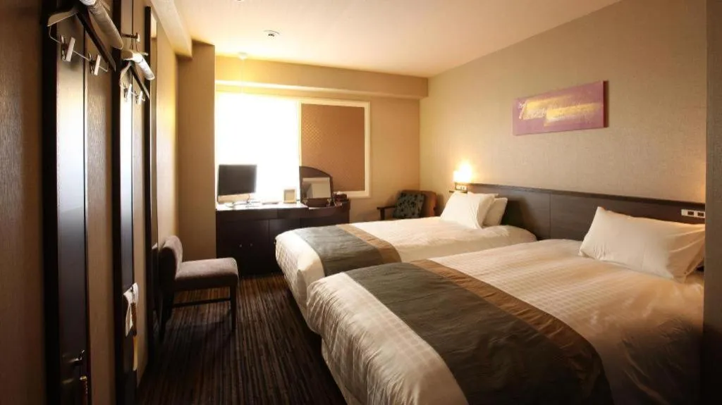 Bed in Ochanomizu Hotel Juraku