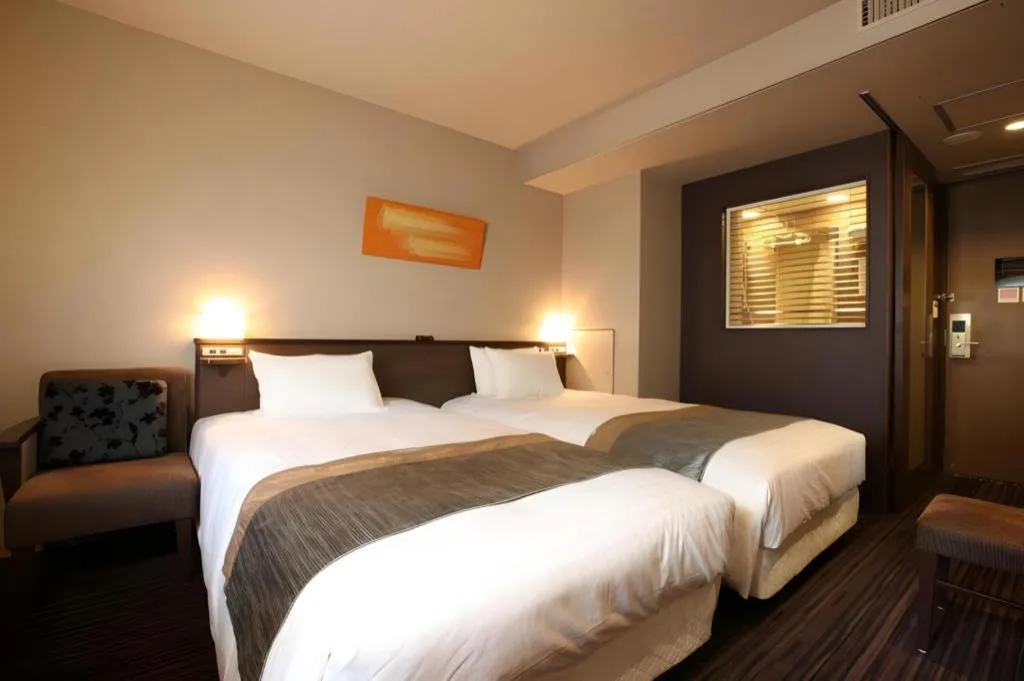 Bed in Ochanomizu Hotel Juraku