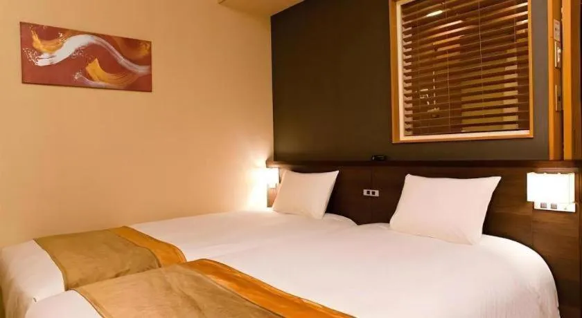 Bed in Ochanomizu Hotel Juraku