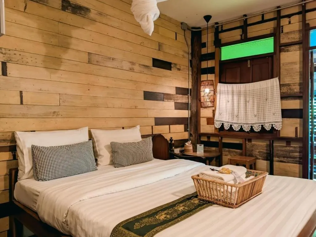 Bed in Huen Chang Puek Hotel