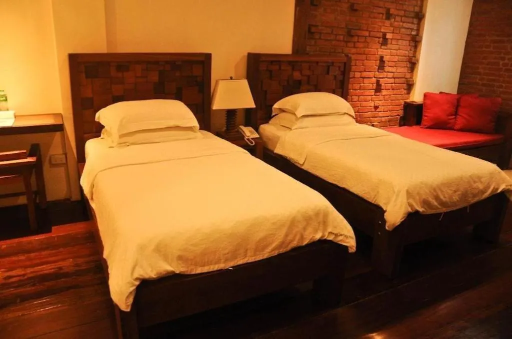 Bed in Mango Valley Hotel