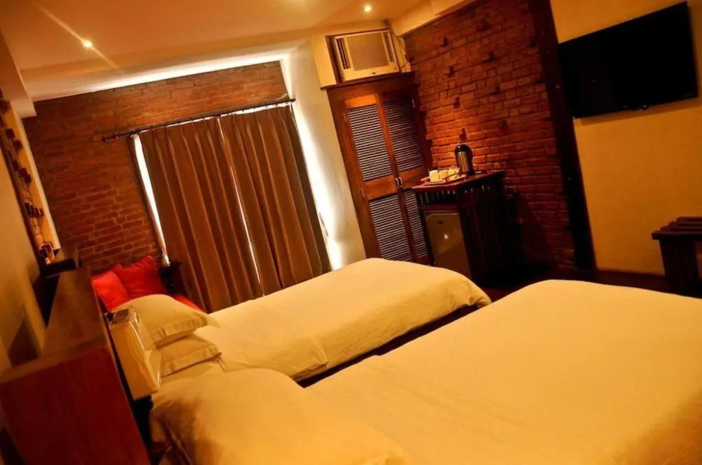 Bed in Mango Valley Hotel