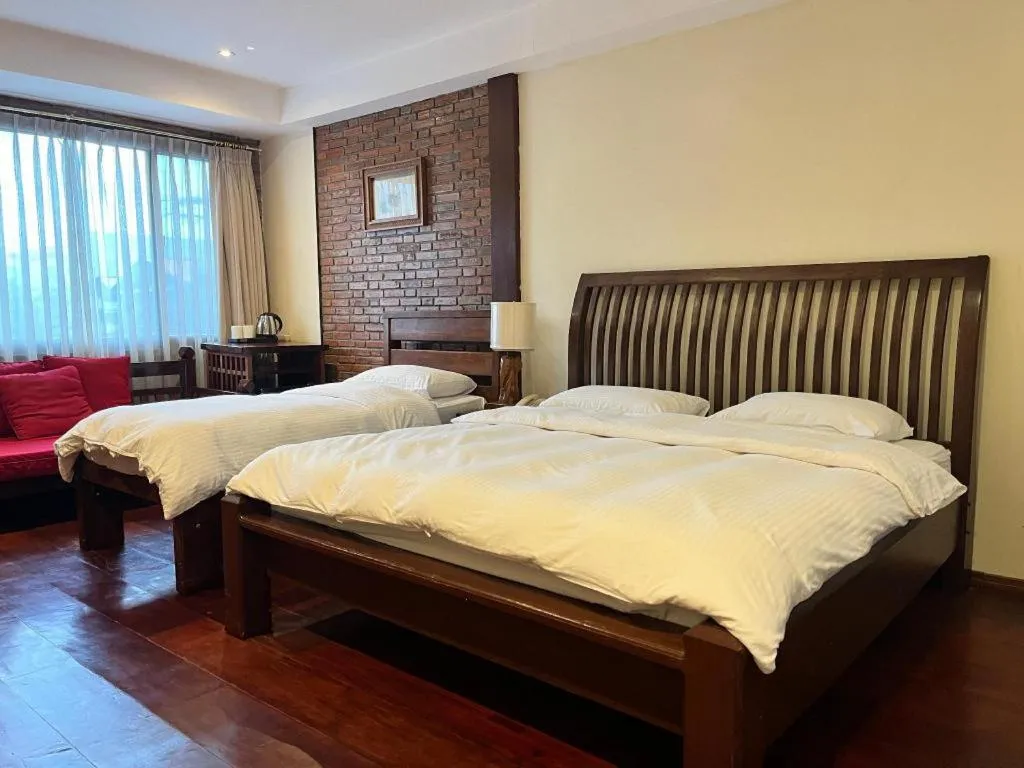 Bed in Mango Valley Hotel