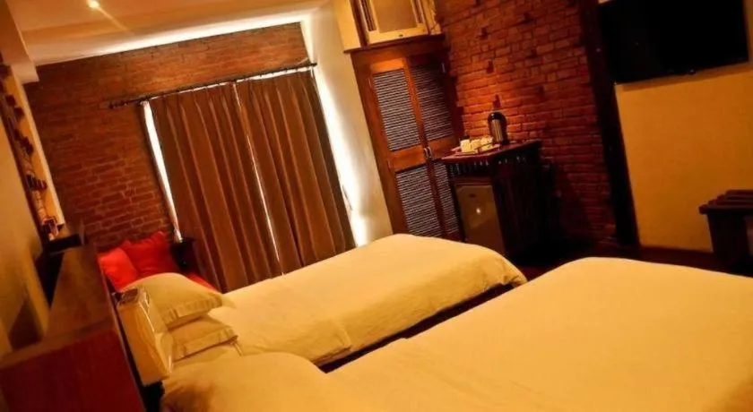 Bed in Mango Valley Hotel