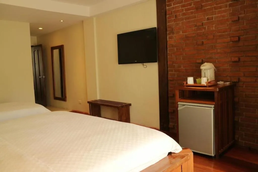 Bed in Mango Valley Hotel