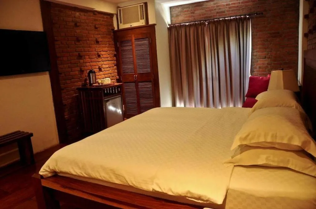 Bed in Mango Valley Hotel