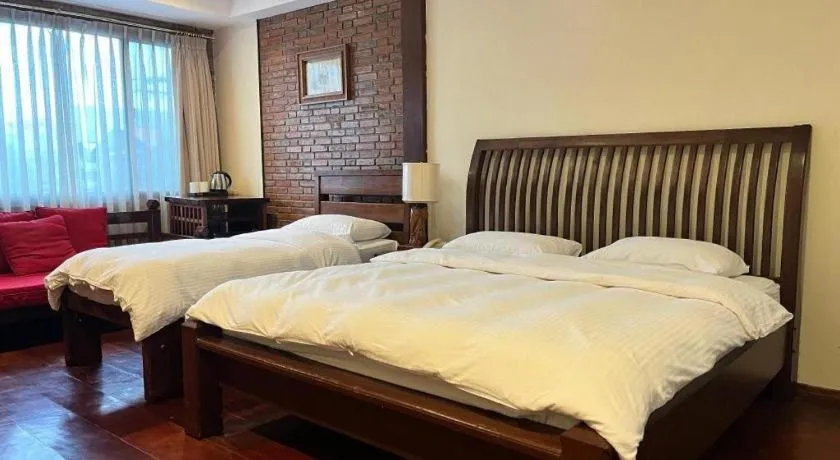 Bed in Mango Valley Hotel