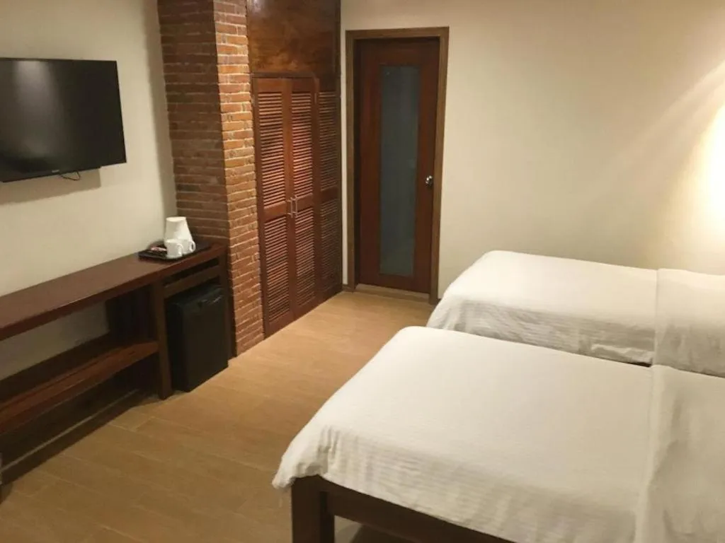 Bed in Mango Valley Hotel