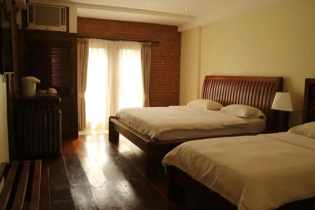 Bed in Mango Valley Hotel