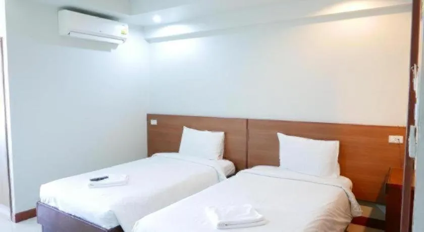 Bed in Century Grand Hotel