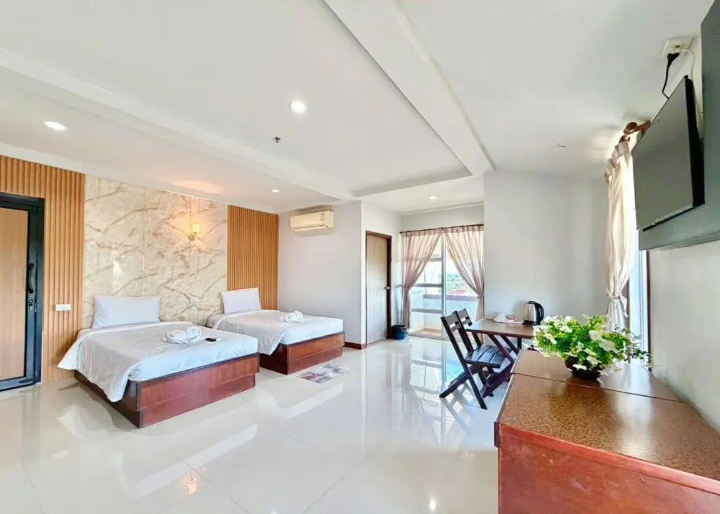 Bed in Century Grand Hotel