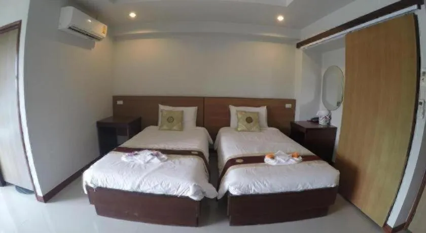 Bed in Century Grand Hotel