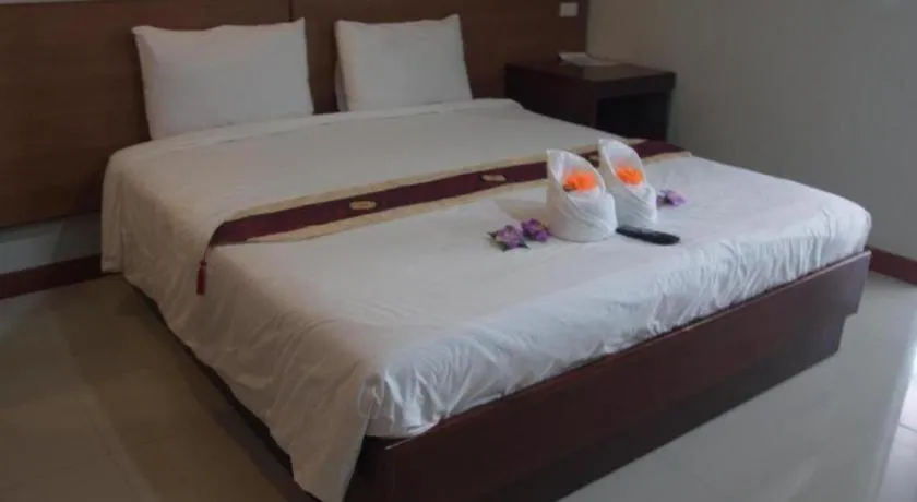 Bed in Century Grand Hotel