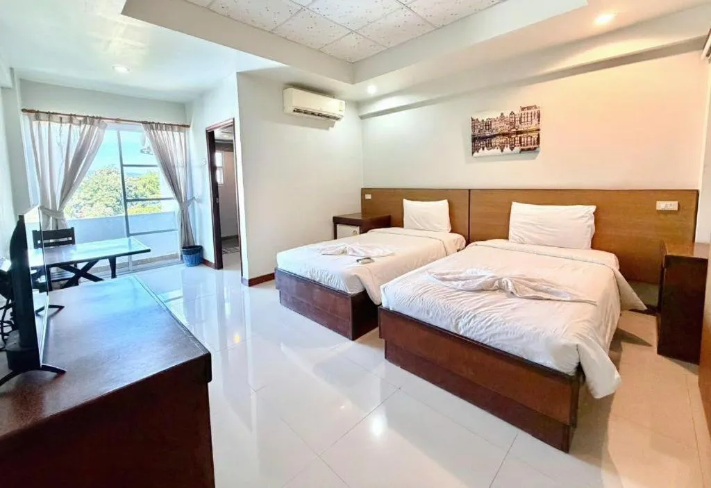 Bed in Century Grand Hotel