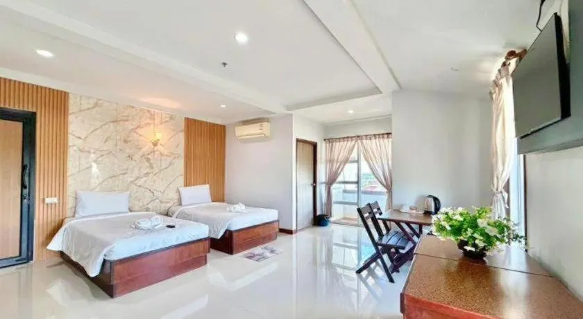 Bed in Century Grand Hotel