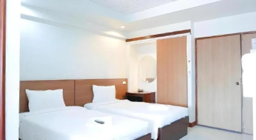 Bed in Century Grand Hotel