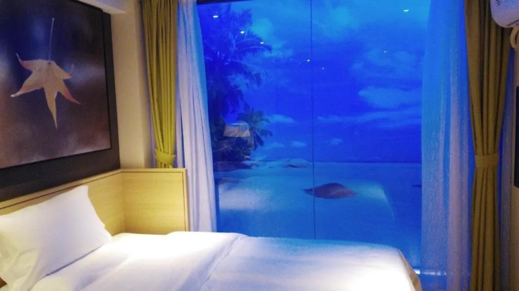 Bed in IU Hotel Zhengzhou Xinzheng Sias International University Branch