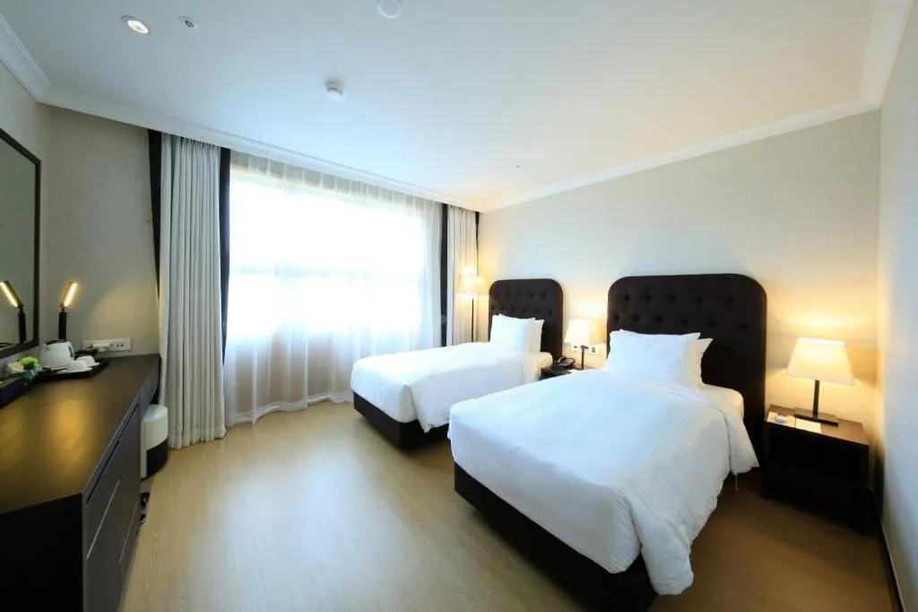 Bed in Jeju Booyoung Hotel